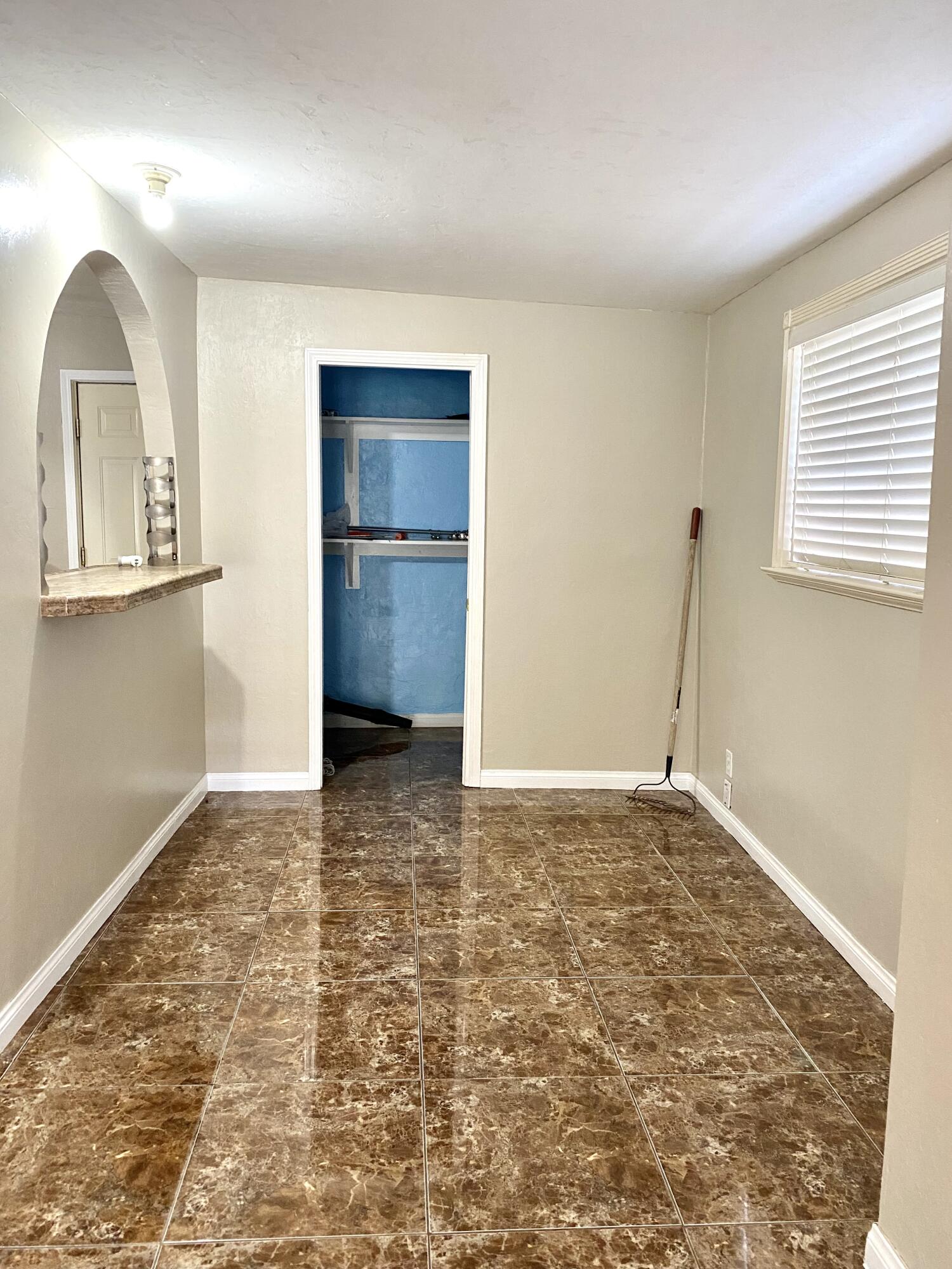 6916 Azalea Avenue Bakersfield, CA 93306 - Photo 7 of 26 a view of an empty room and window