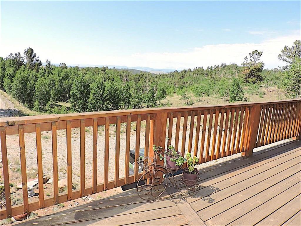 299 Gadwall Road Como, CO 80432 - Photo 12 of 25 a view of balcony with wooden floor and fence