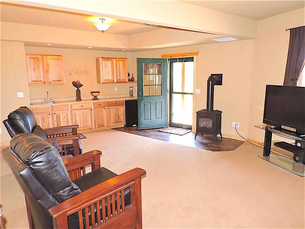 299 Gadwall Road Como, CO 80432 - Photo 17 of 25 a living room with furniture a flat screen tv and a window