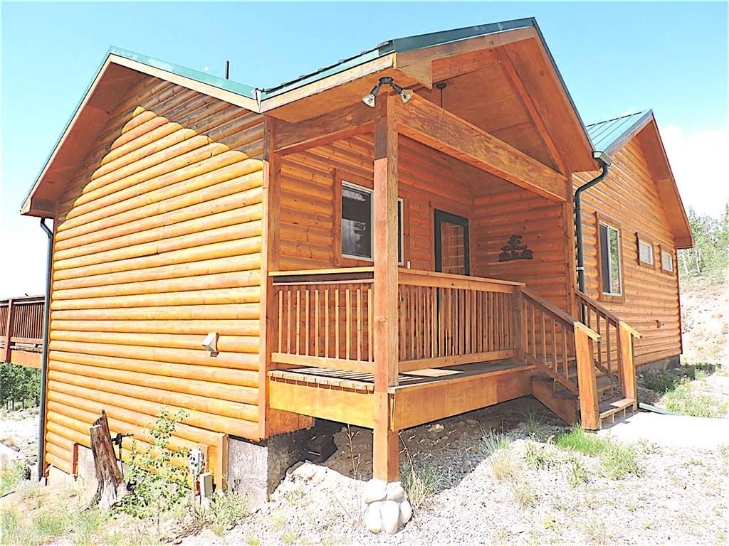 299 Gadwall Road Como, CO 80432 - Photo 3 of 25 a view of a house with a backyard and wooden fence