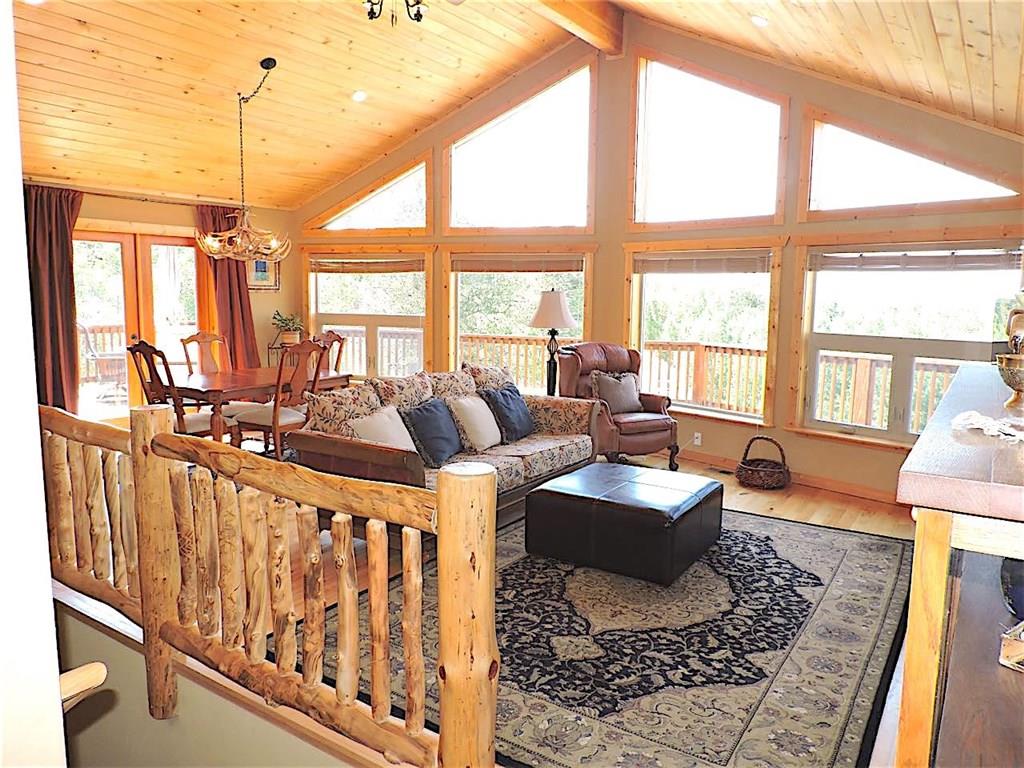 299 Gadwall Road Como, CO 80432 - Photo 4 of 25 a living room with furniture and floor to ceiling windows