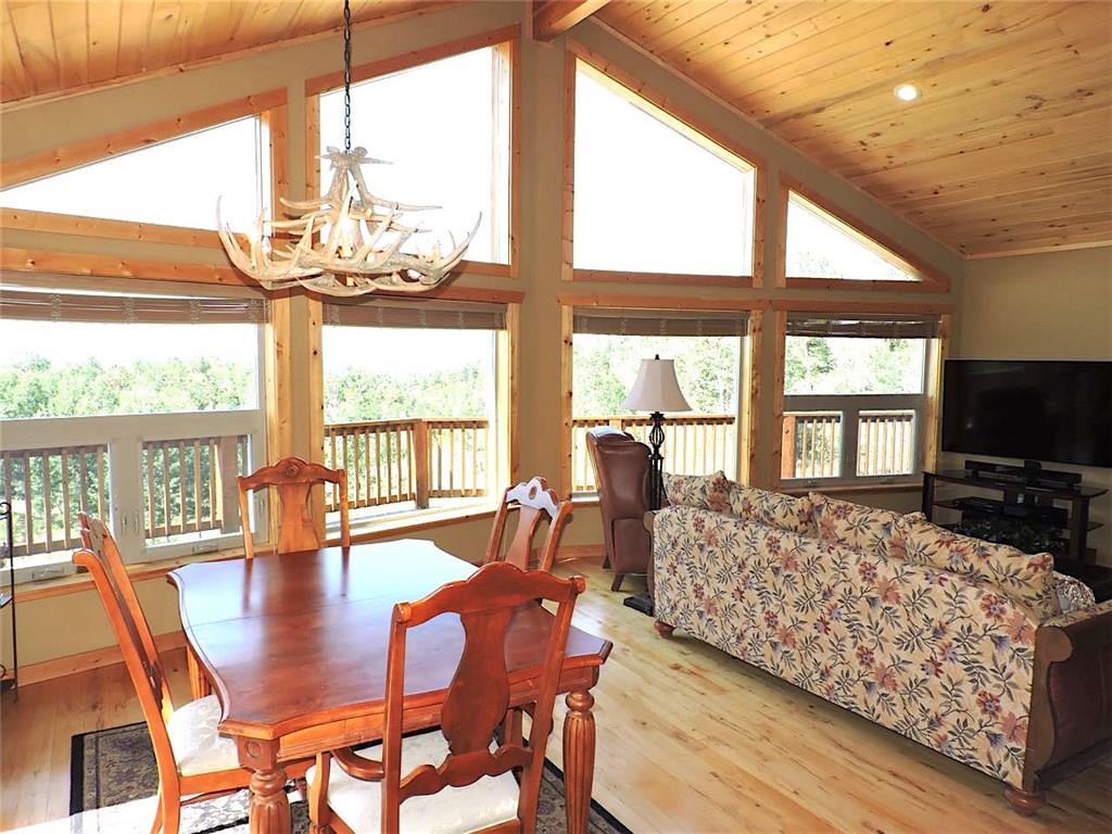 299 Gadwall Road Como, CO 80432 - Photo 5 of 25 a living room with furniture large windows and wooden floor
