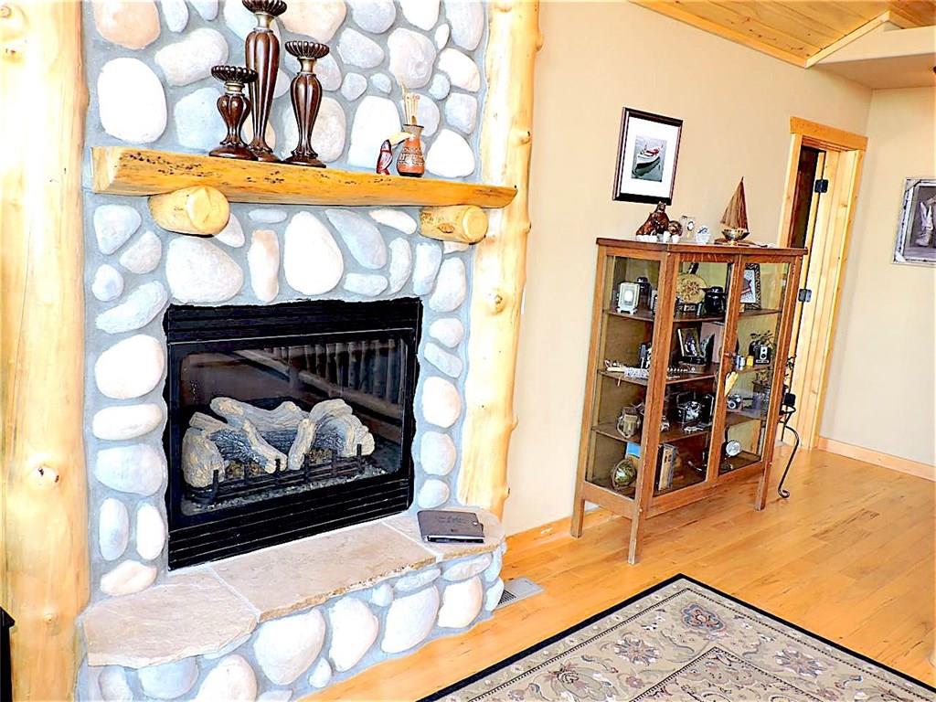 299 Gadwall Road Como, CO 80432 - Photo 10 of 25 a living room with furniture and a fireplace