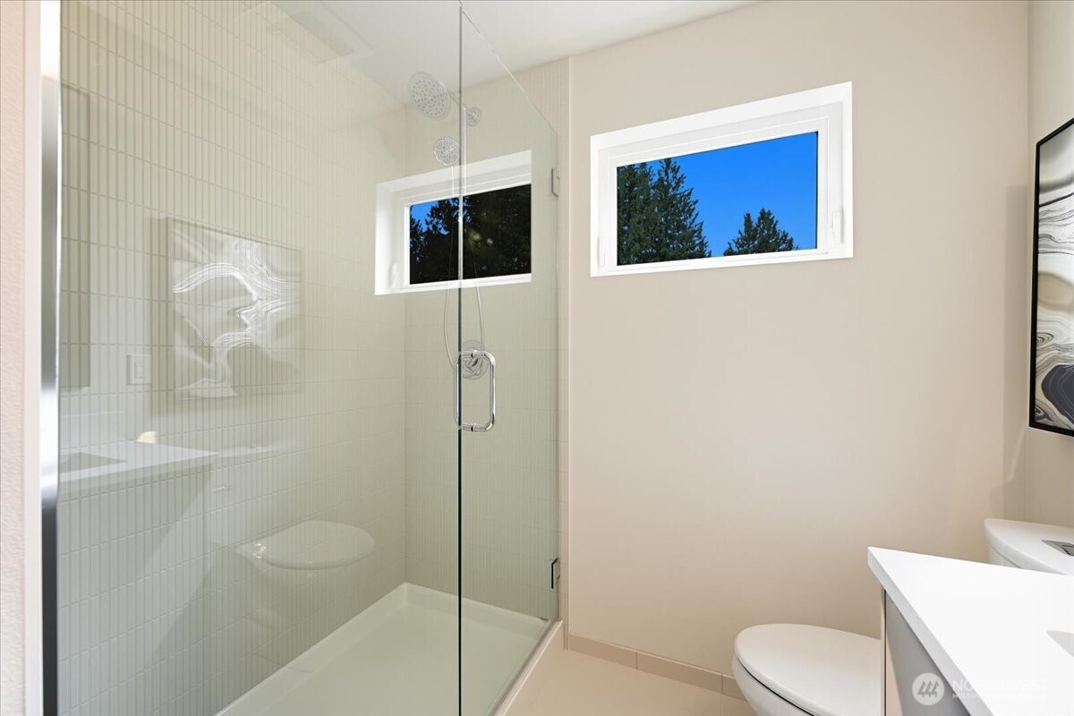 13047 39th Avenue Northeast, Unit B Seattle, WA 98125 - Photo 11 of 16 a bathroom with a toilet sink and shower