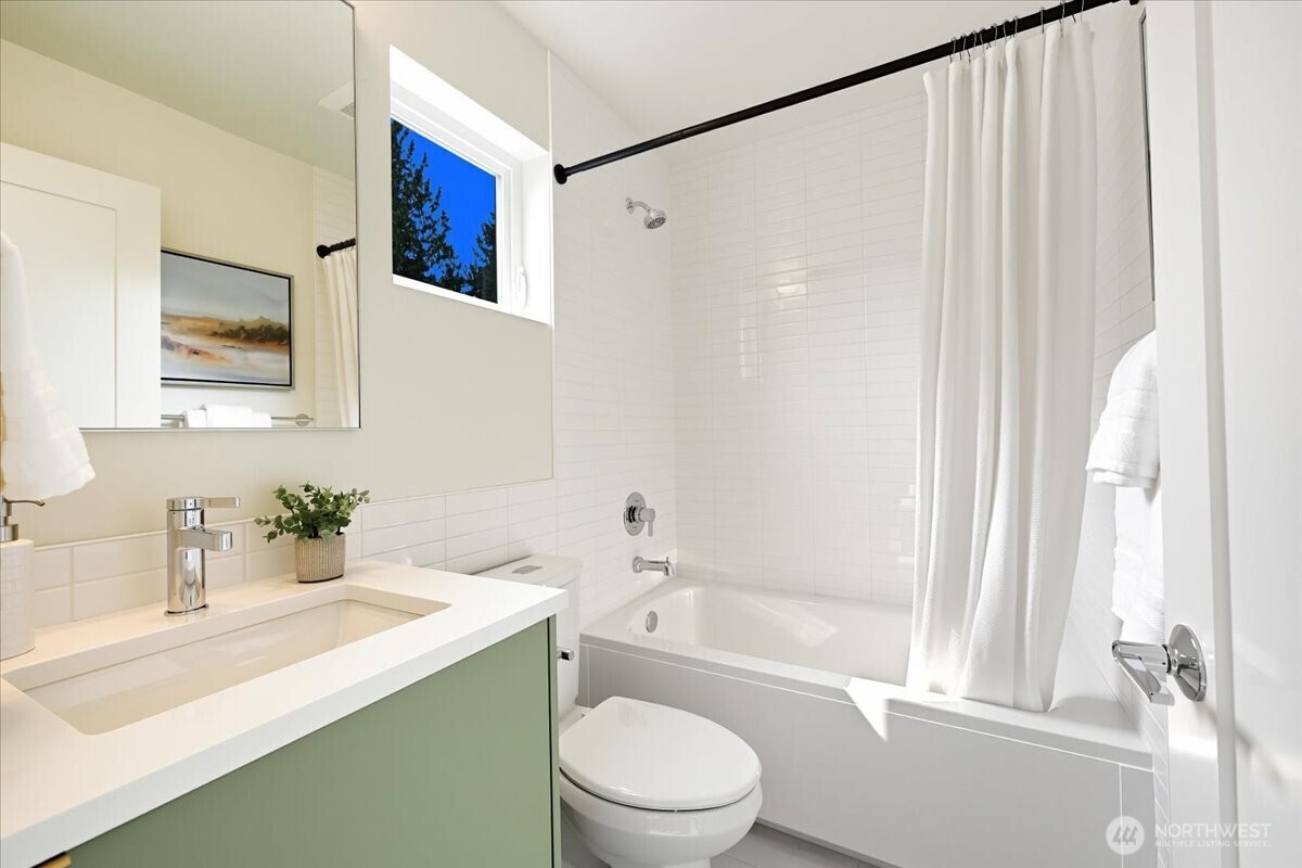 13047 39th Avenue Northeast, Unit B Seattle, WA 98125 - Photo 14 of 16 a bathroom with a sink toilet and shower