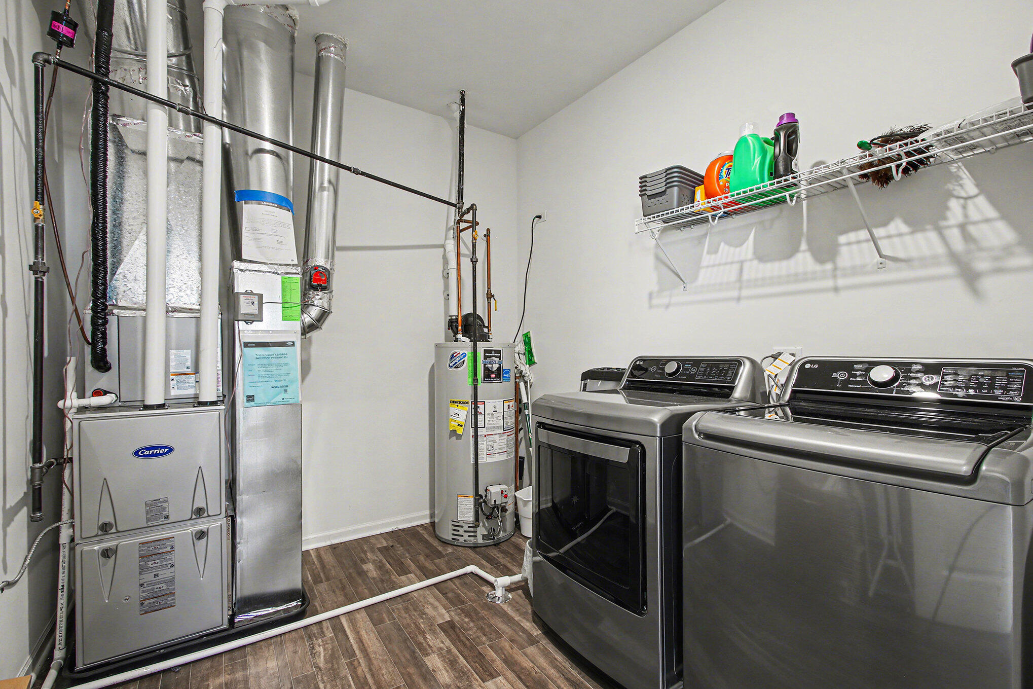 11649 Thomas Street Winfield, IN 46307 - Photo 12 of 15 a kitchen with stainless steel appliances granite countertop a refrigerator and a stove