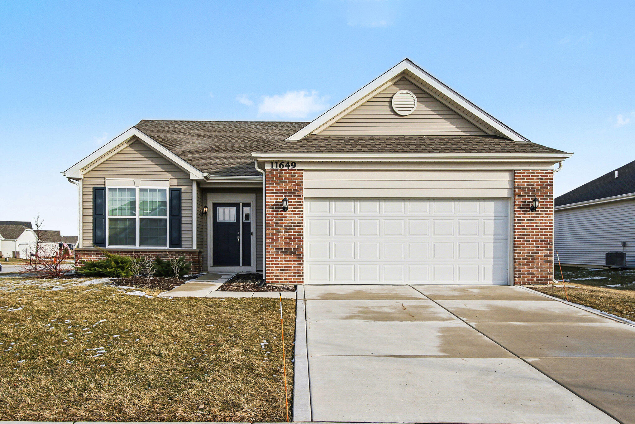 11649 Thomas Street Winfield, IN 46307 - Photo 14 of 15 a front view of a house with garden