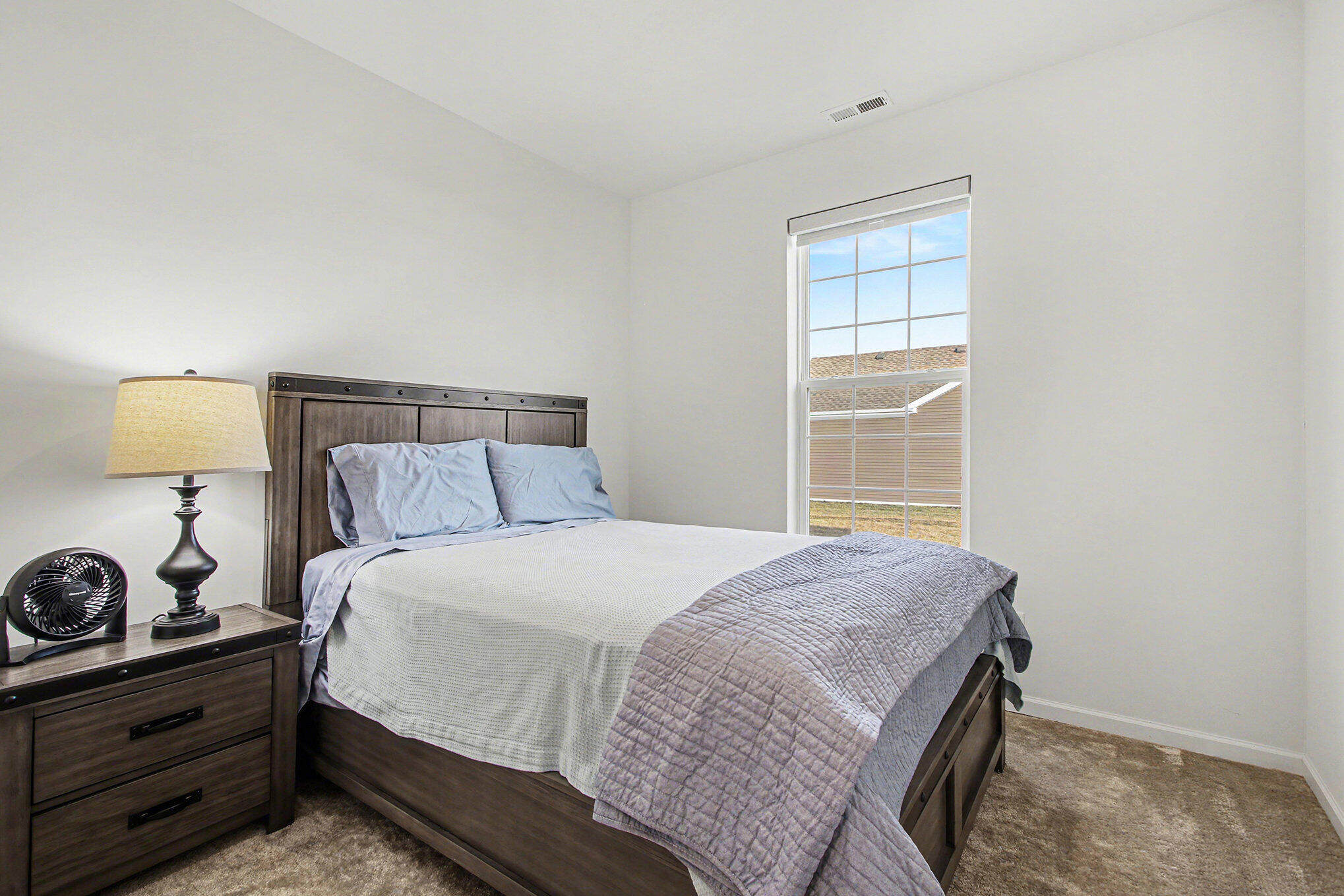 11649 Thomas Street Winfield, IN 46307 - Photo 10 of 15 a bedroom with a bed and a window