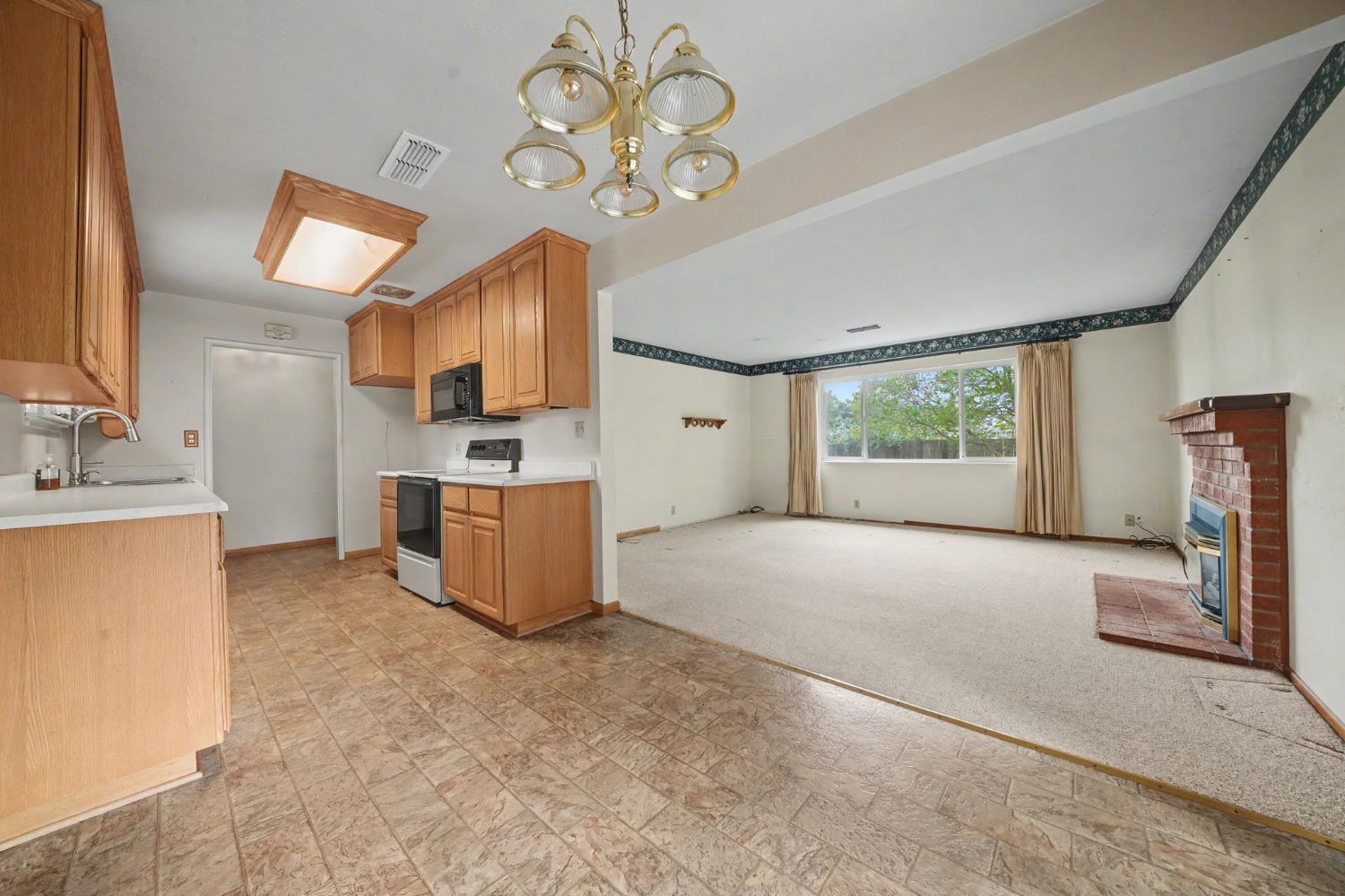 626 Sutter Lane Ione, CA 95640 - Photo 5 of 21 a view of a kitchen with furniture and a kitchen view