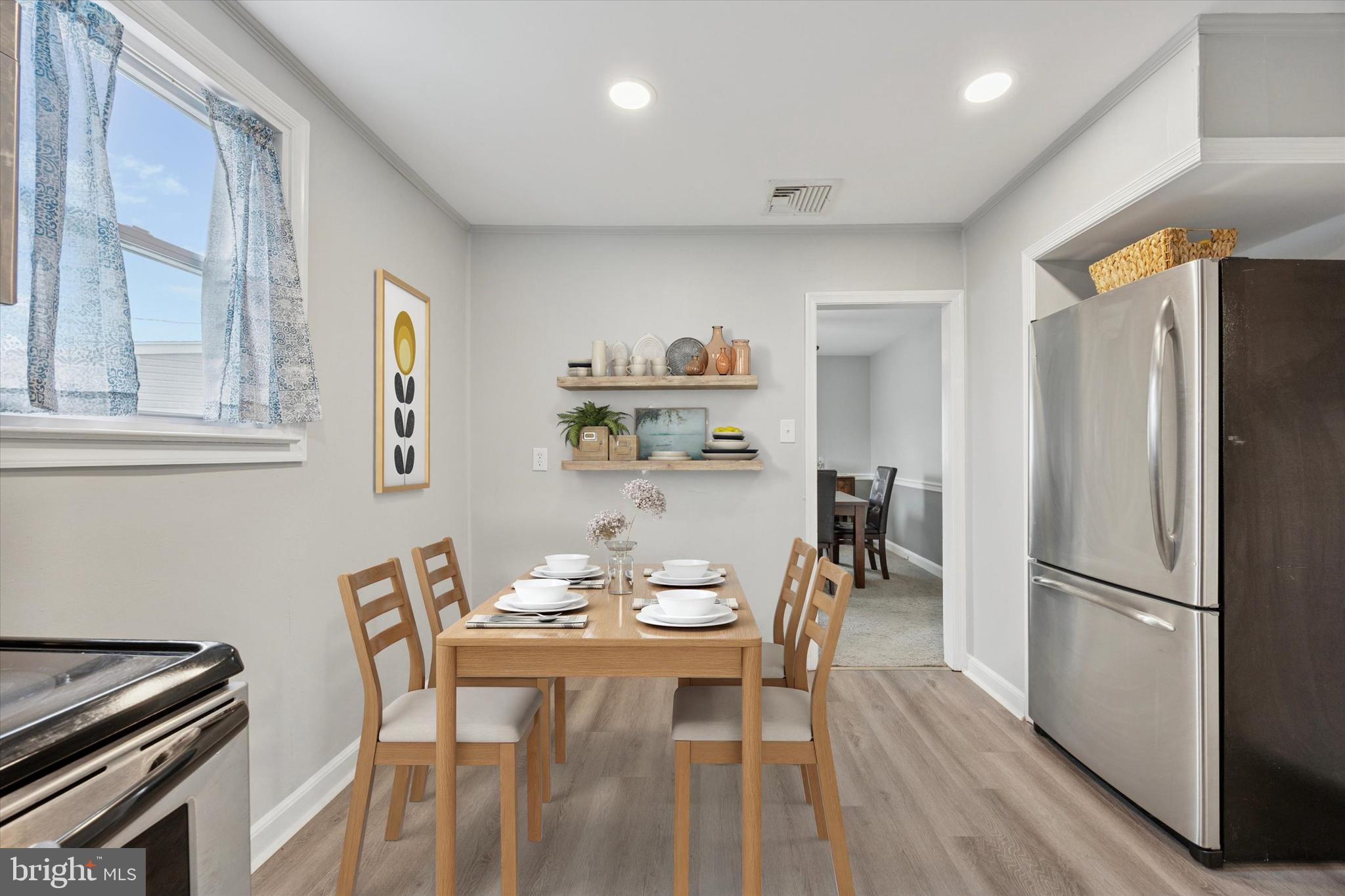 181 Friendship Road Drexel Hill, PA 19026 - Photo 11 of 24 a view of a dining room with furniture a chandelier and wooden floor