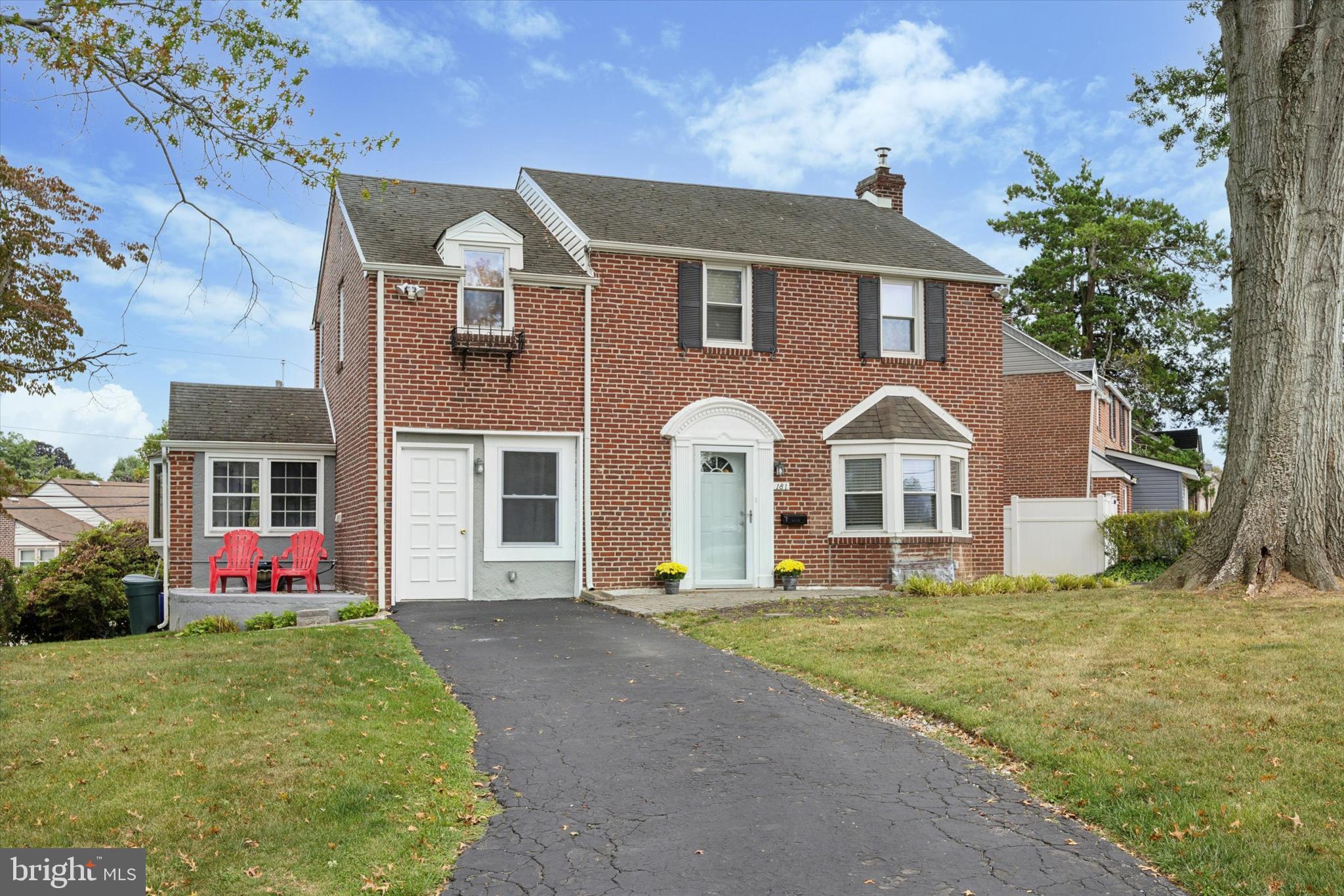 181 Friendship Road Drexel Hill, PA 19026 - Photo 2 of 24 a front view of a house with a yard and garage