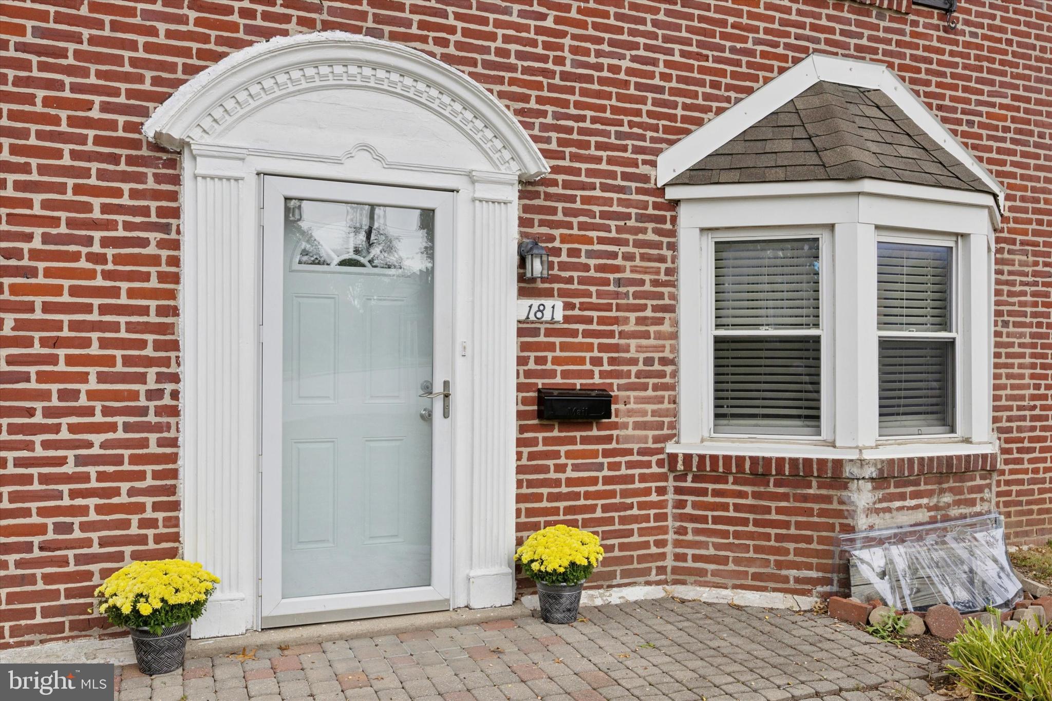 181 Friendship Road Drexel Hill, PA 19026 - Photo 4 of 24 a view of a brick house with a window