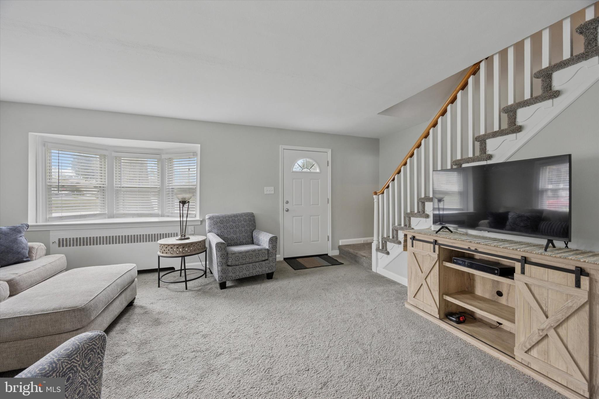 181 Friendship Road Drexel Hill, PA 19026 - Photo 6 of 24 a living room with furniture and a flat screen tv