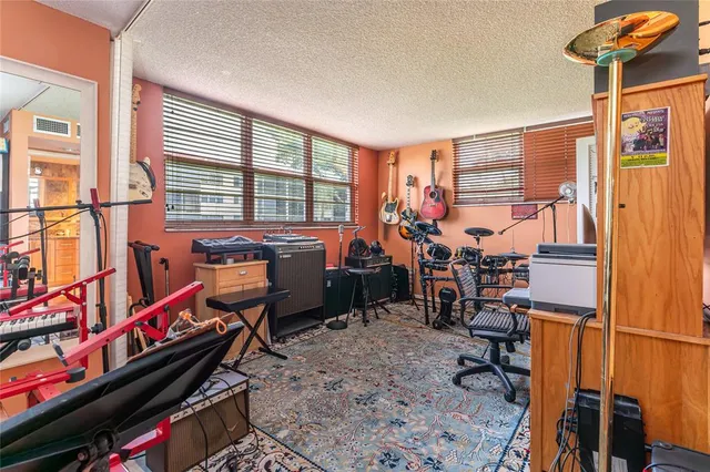 a view of a garden with a building in the background