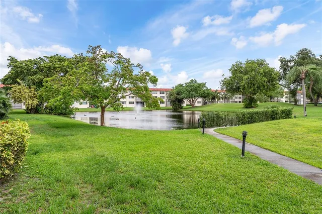 a utility room with cabinets washer and dryer