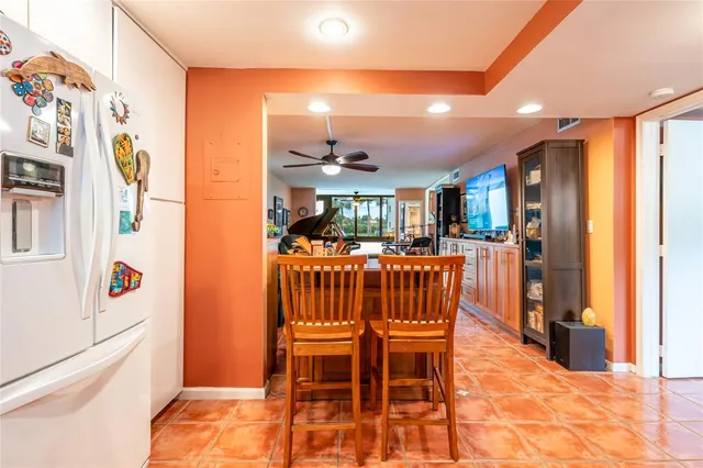 a bedroom with a bed and ceiling fan