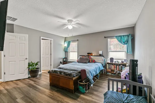 a bed room with a bed and a window