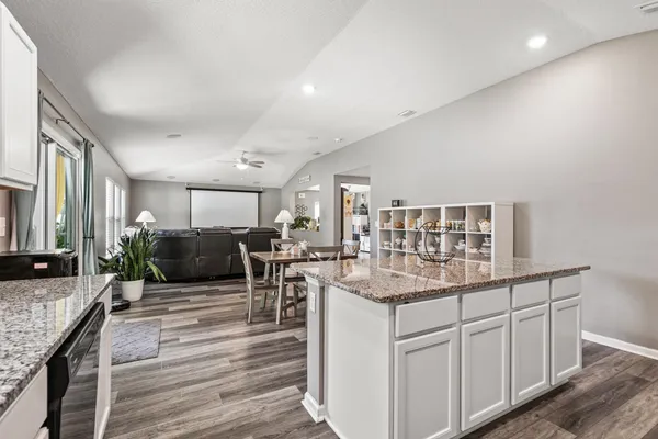 a kitchen with sink and cabinets