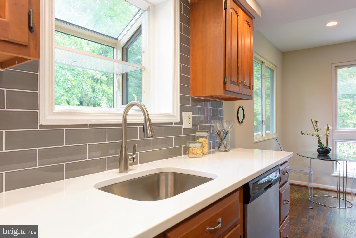 10902 Howland Drive Reston, VA 20191 - Photo 11 of 43 Quartz Countertops and Glass Subway Tile