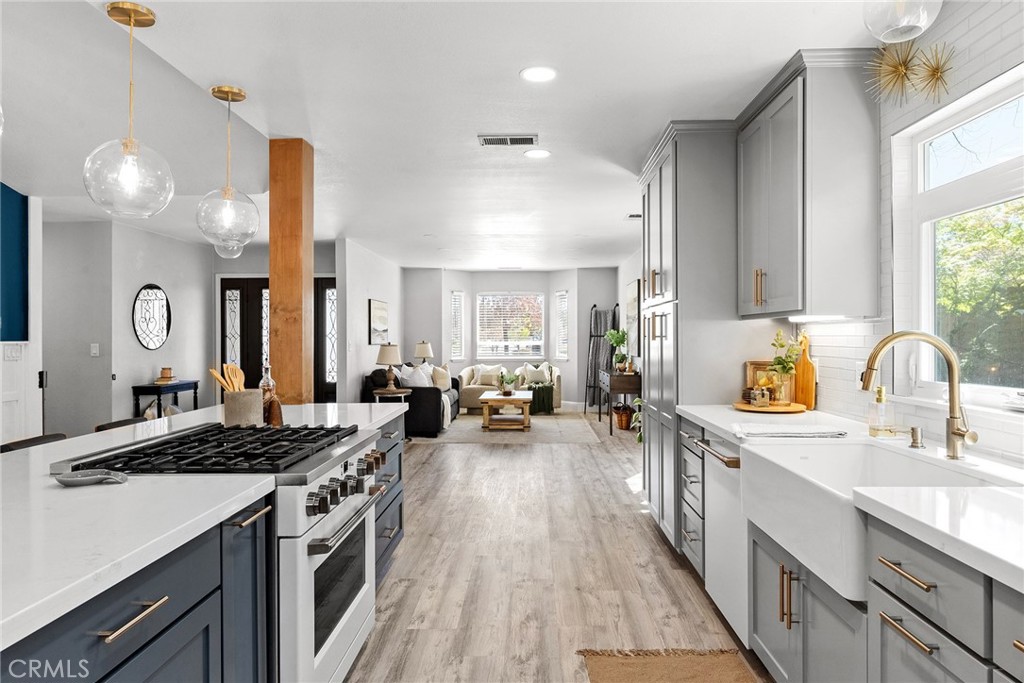 2 Baroni Drive Chico, CA 95928 - Photo 17 of 63 a kitchen with sink stove and cabinets