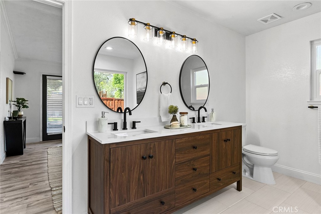 2 Baroni Drive Chico, CA 95928 - Photo 27 of 63 a bathroom with a double vanity sink and a mirror