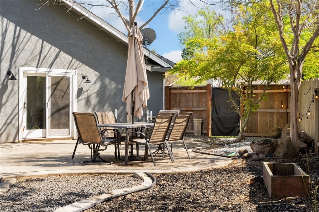 2 Baroni Drive Chico, CA 95928 - Photo 43 of 63 a view of a patio with table and chairs and potted plants
