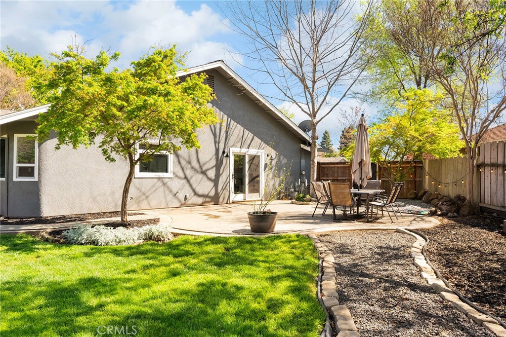 2 Baroni Drive Chico, CA 95928 - Photo 46 of 63 a view of a backyard with table and chairs and a fire pit