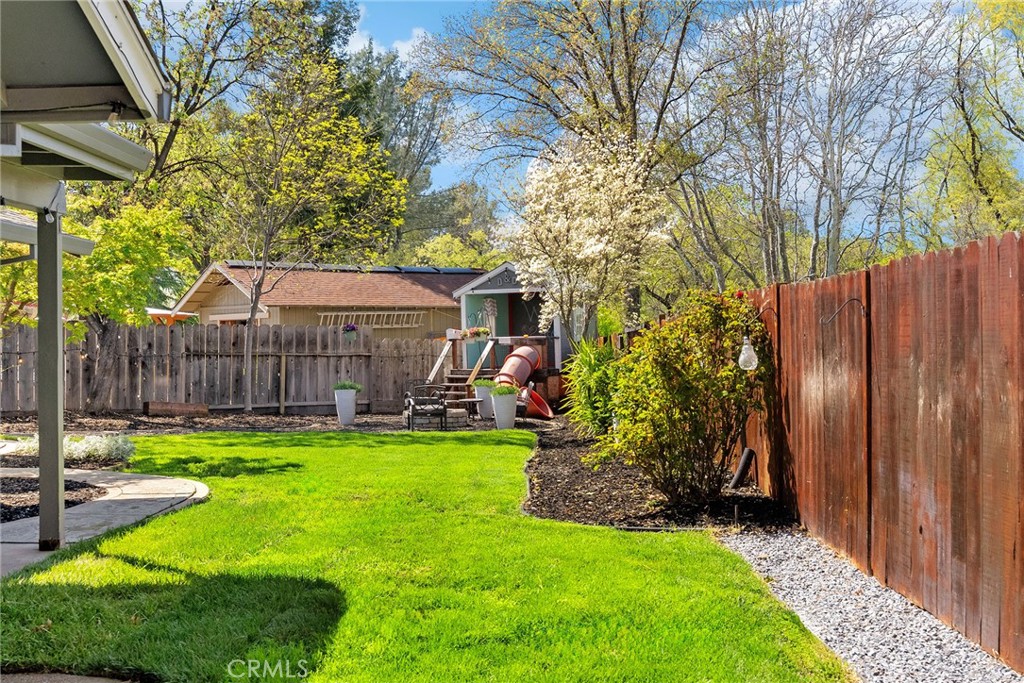 2 Baroni Drive Chico, CA 95928 - Photo 48 of 63 a view of a house with backyard and wooden fence
