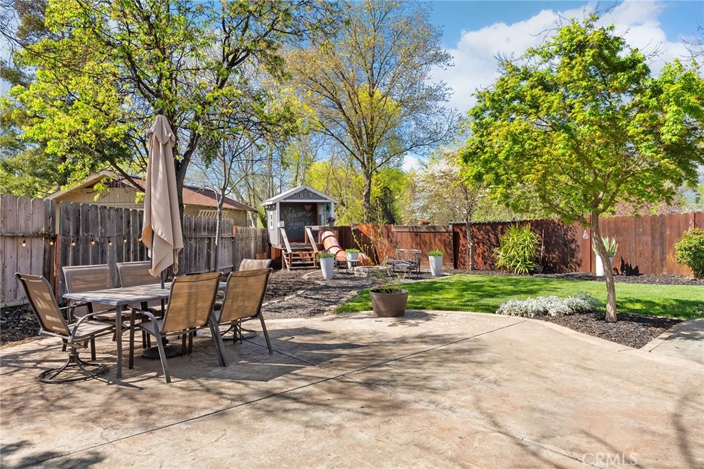2 Baroni Drive Chico, CA 95928 - Photo 55 of 63 a view of a patio with table and chairs and potted plants