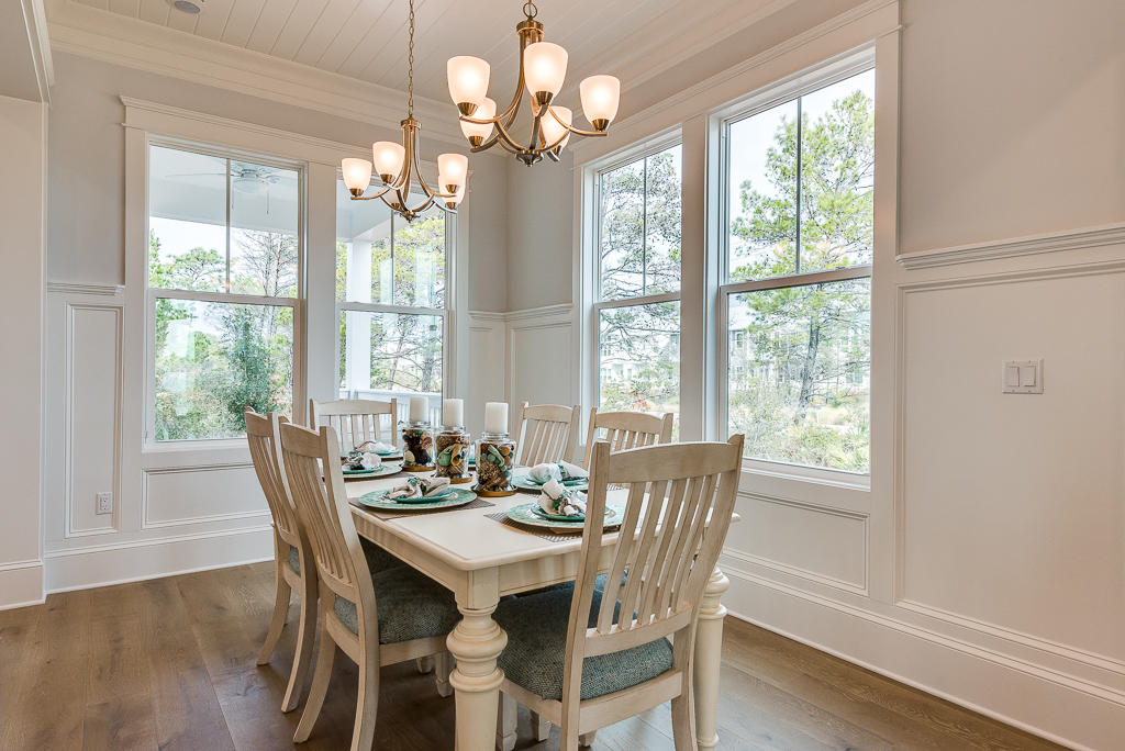 20 Prominence Square Inlet Beach Inlet Beach, FL 32461 - Photo 11 of 53 a view of a dining room with furniture wooden floor and chandelier