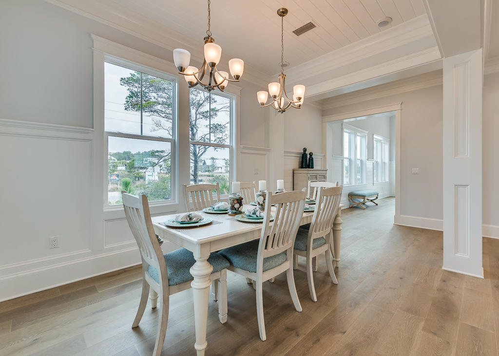 20 Prominence Square Inlet Beach Inlet Beach, FL 32461 - Photo 12 of 53 a view of a dining room with furniture wooden floor and chandelier
