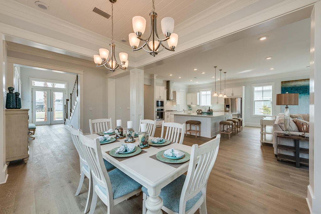20 Prominence Square Inlet Beach Inlet Beach, FL 32461 - Photo 13 of 53 a view of a dining room and livingroom with furniture wooden floor a chandelier