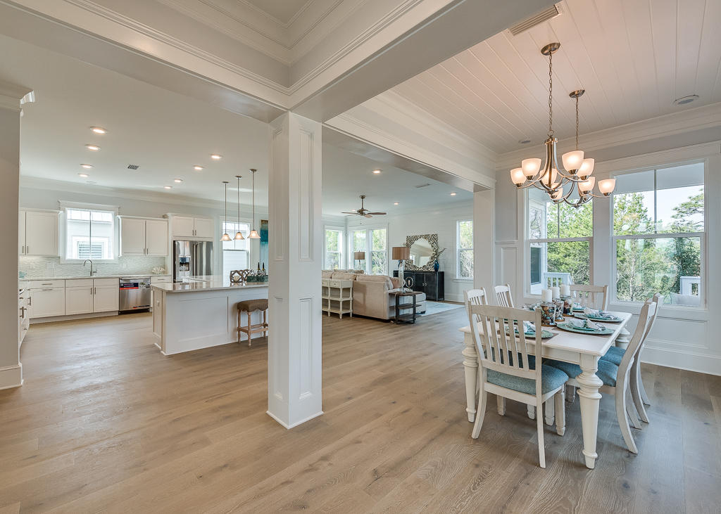 20 Prominence Square Inlet Beach Inlet Beach, FL 32461 - Photo 21 of 53 a view of a dining room and livingroom with furniture wooden floor a chandelier
