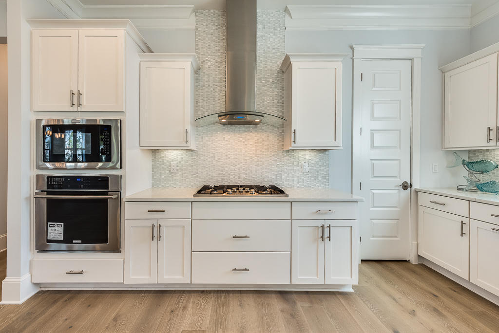 20 Prominence Square Inlet Beach Inlet Beach, FL 32461 - Photo 23 of 53 a kitchen with granite countertop white cabinets and white appliances