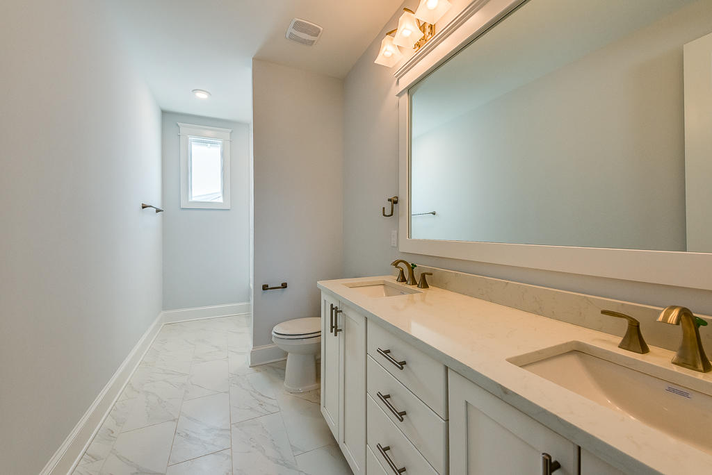 20 Prominence Square Inlet Beach Inlet Beach, FL 32461 - Photo 30 of 53 a bathroom with a granite countertop sink toilet and mirror