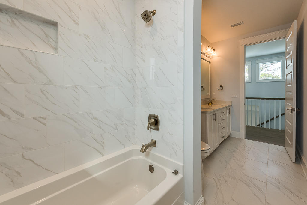 20 Prominence Square Inlet Beach Inlet Beach, FL 32461 - Photo 31 of 53 a bathroom with a tub a sink and mirror
