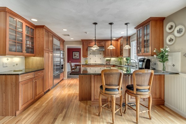 3 Wildwood Road Lexington, MA 02421 - Photo 1 of 19 a dining room with stainless steel appliances granite countertop a kitchen island hardwood floor and a sink