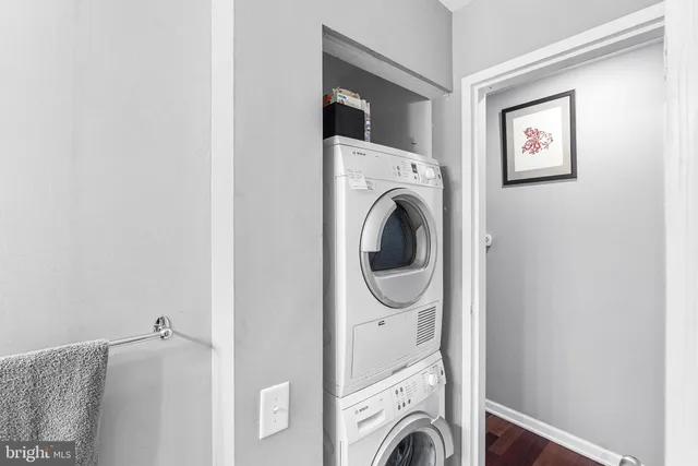 a workspace with an entryway and wooden floor