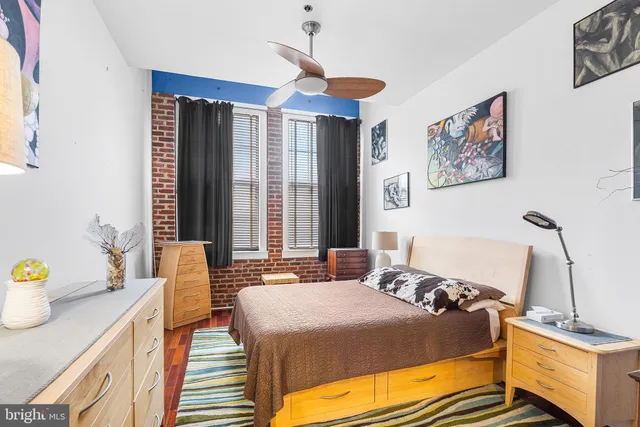 a bed room with a bed and a tv