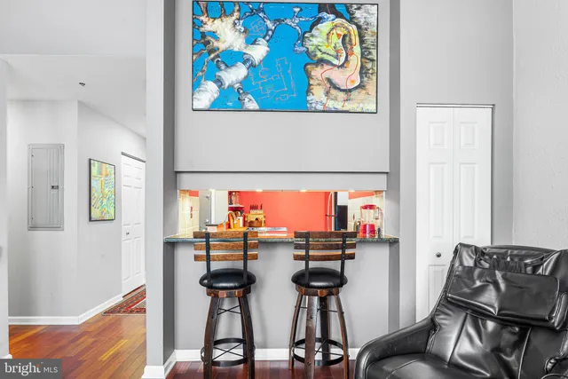 a kitchen with stainless steel appliances a microwave a stove and cabinets