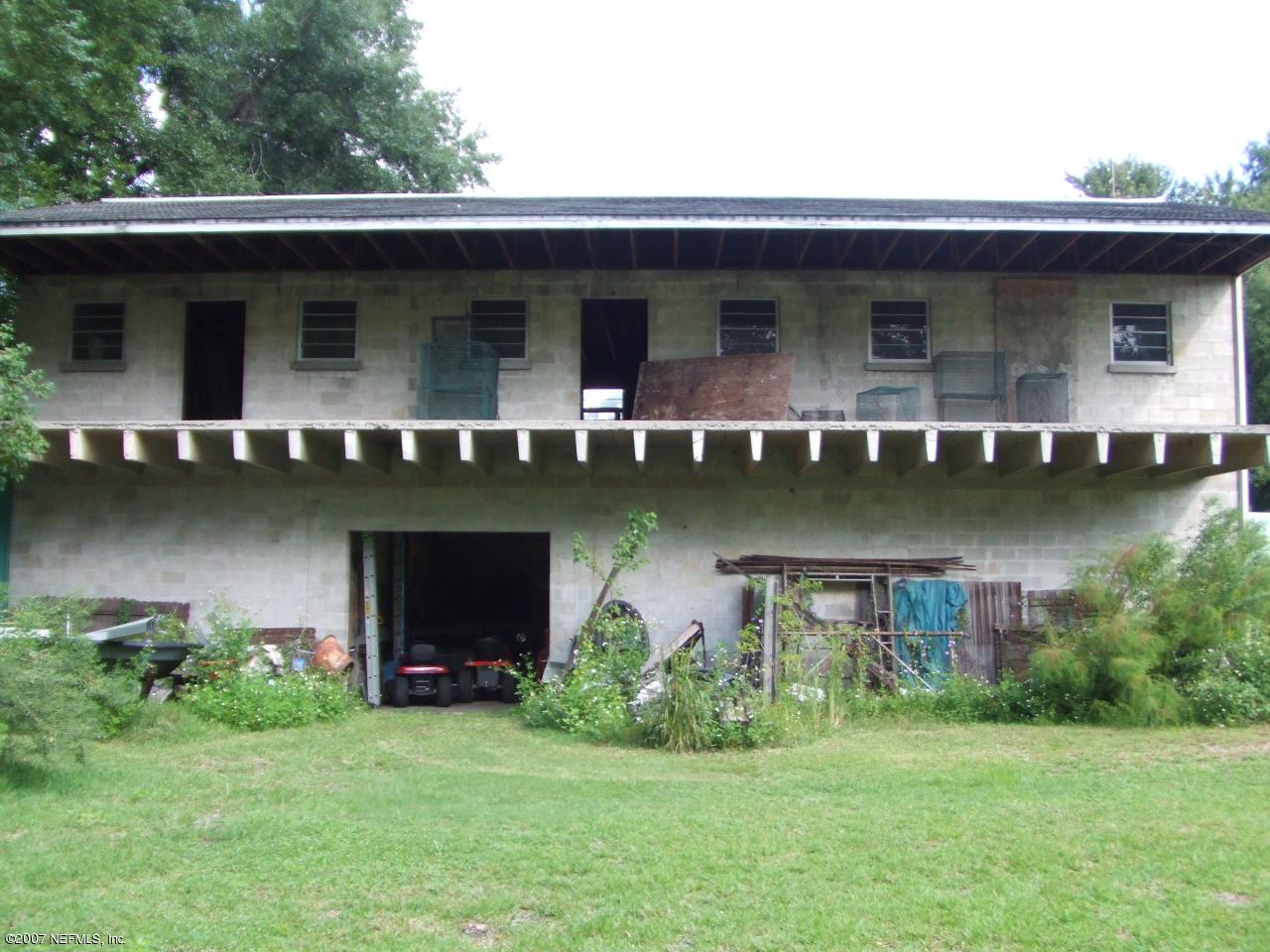 0 Comanche Street Jacksonville, FL 32205 - Photo 2 of 5 a front view of house with yard and lake