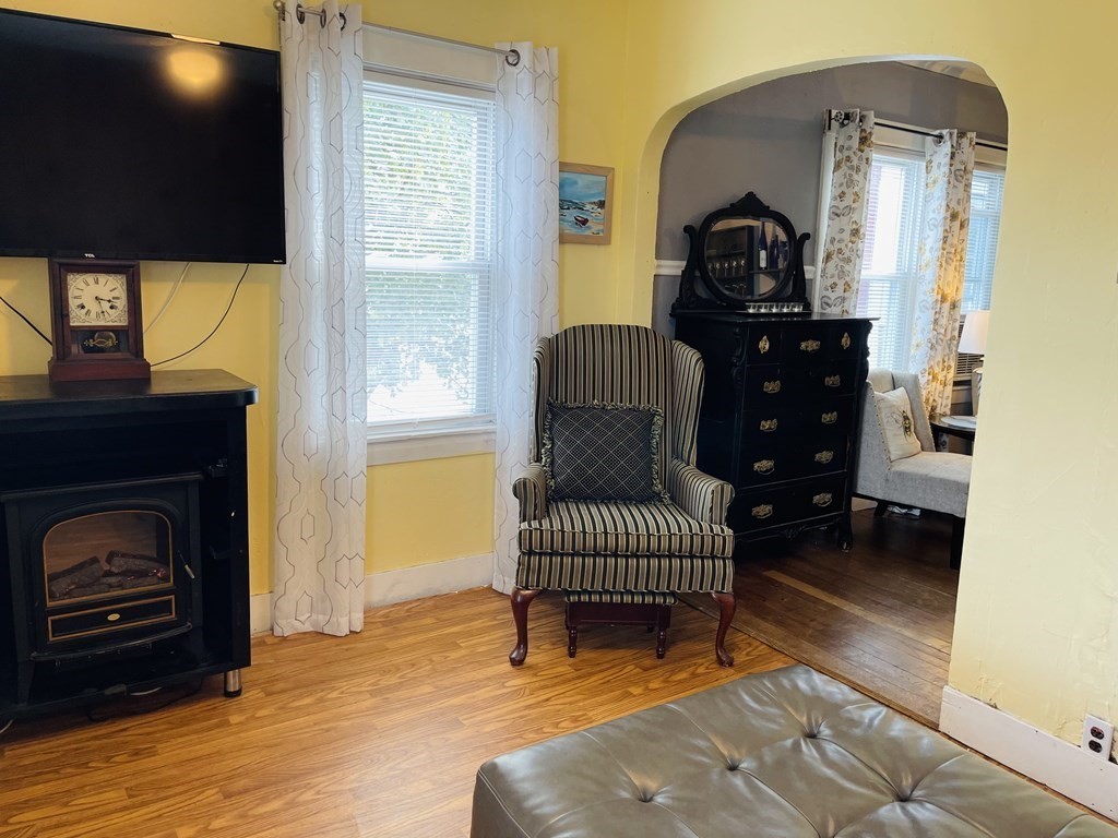 61 Fenner Street Fall River, MA 02724 - Photo 19 of 23 a living room with furniture and a fireplace