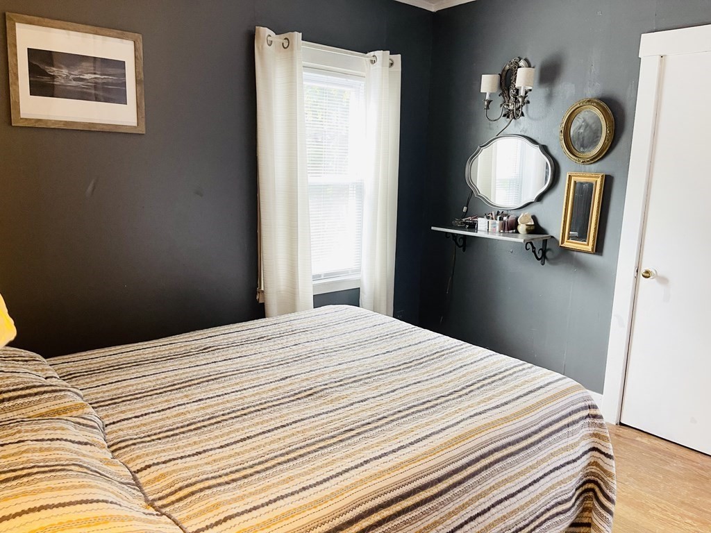 61 Fenner Street Fall River, MA 02724 - Photo 20 of 23 a bedroom with a bed and painting on the wall