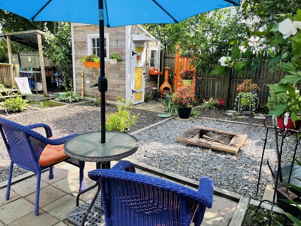 61 Fenner Street Fall River, MA 02724 - Photo 4 of 23 a backyard of a house with barbeque oven table and chairs