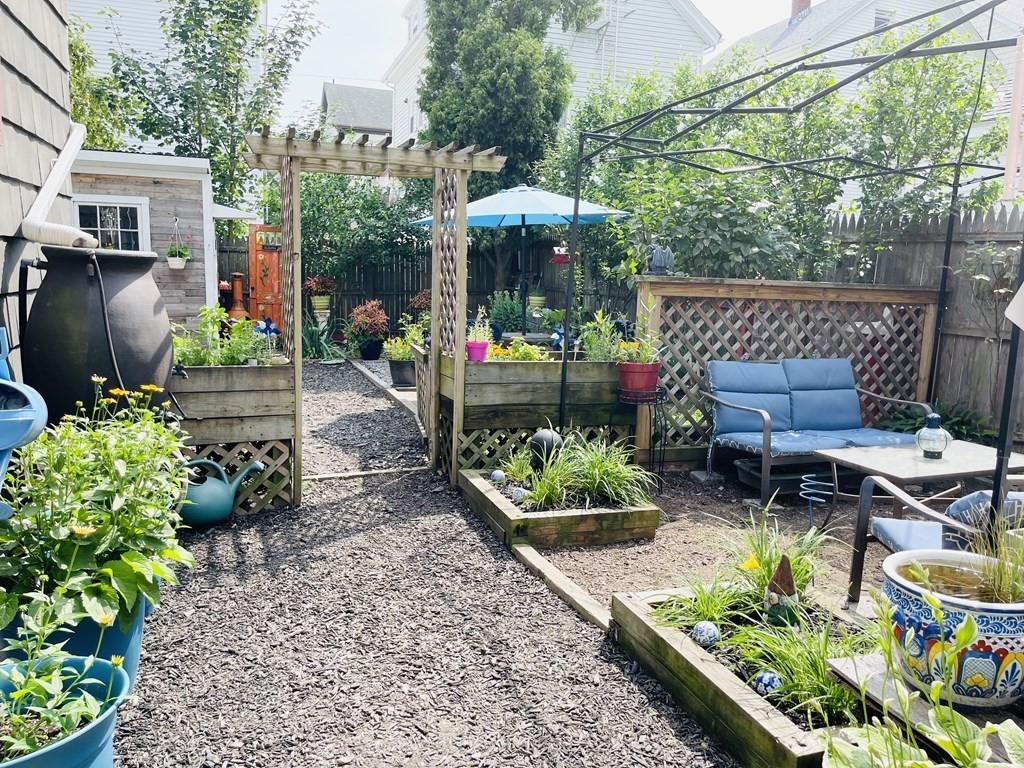 61 Fenner Street Fall River, MA 02724 - Photo 5 of 23 a view of a chairs and table in the garden