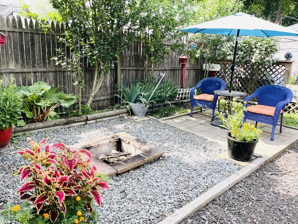 61 Fenner Street Fall River, MA 02724 - Photo 7 of 23 a view of a chairs and table in backyard