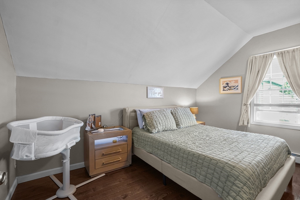 249 Baird Street Fall River, MA 02721 - Photo 12 of 23 a bedroom with a bed and a chair