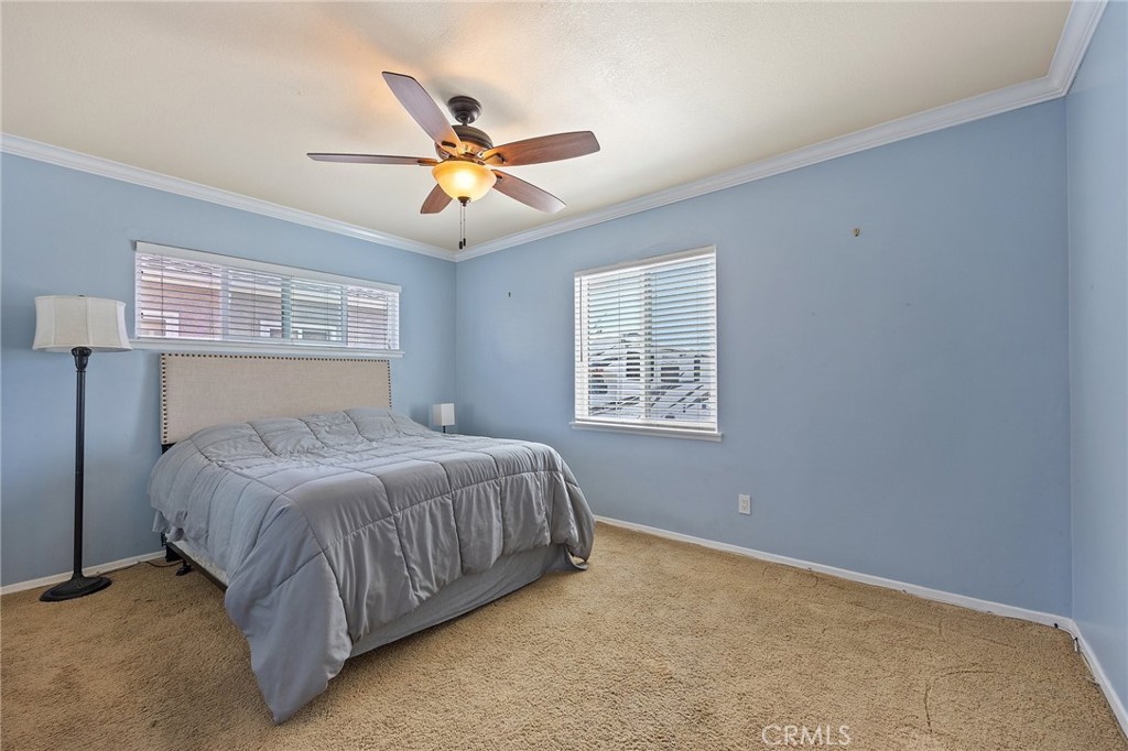 14895 Fairvilla Drive La Mirada, CA 90638 - Photo 16 of 31 a bedroom with a bed and window