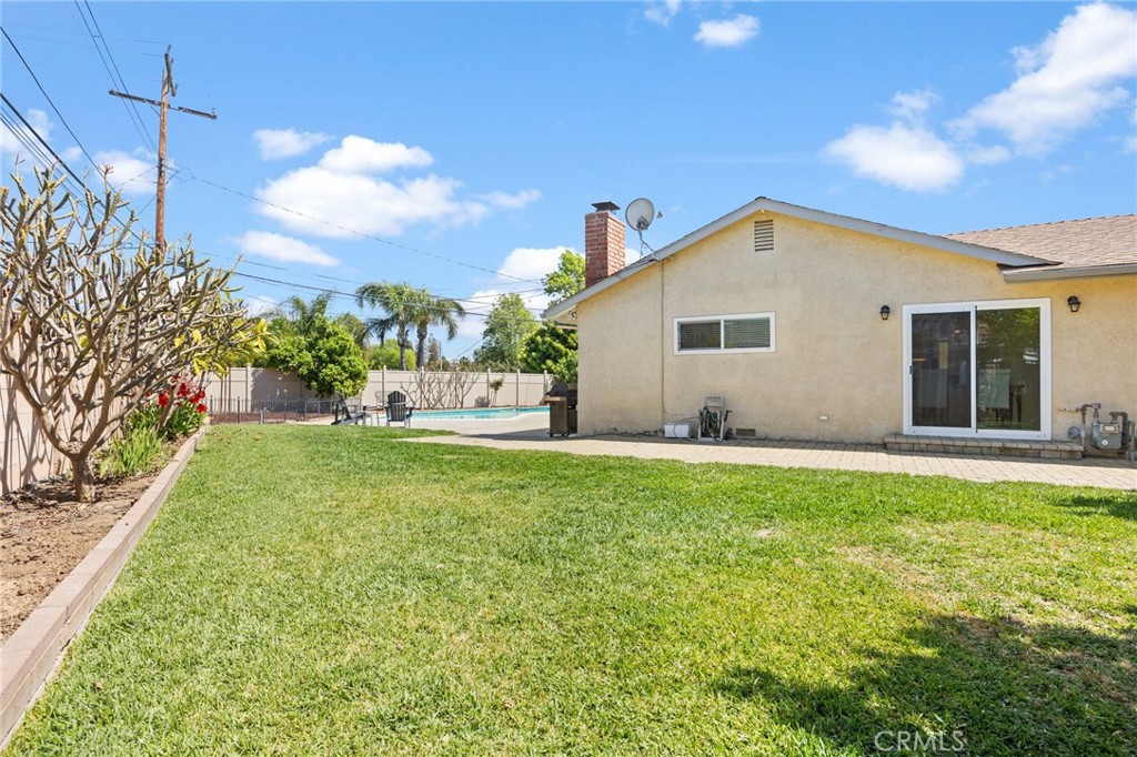 14895 Fairvilla Drive La Mirada, CA 90638 - Photo 25 of 31 a backyard of a house with plants and outdoor seating