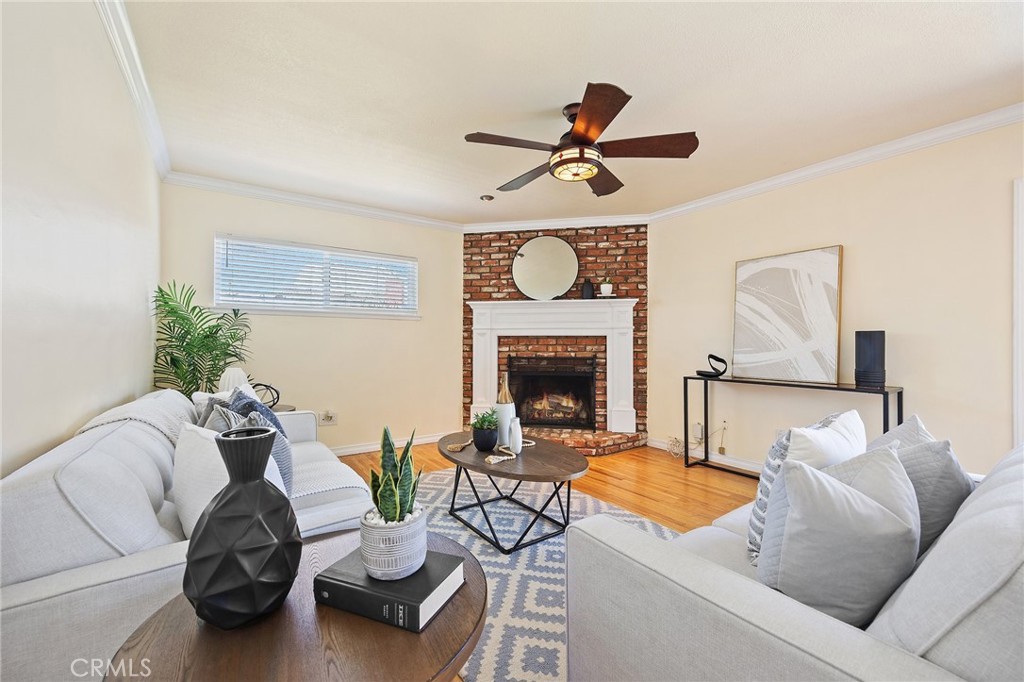 14895 Fairvilla Drive La Mirada, CA 90638 - Photo 4 of 31 a living room with furniture and a fireplace